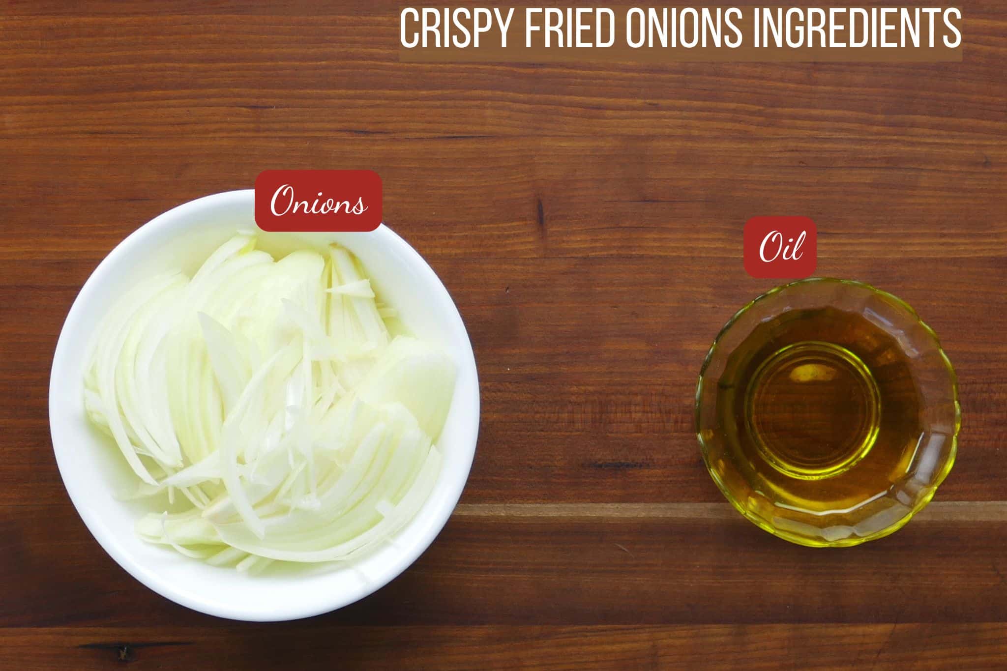 Ingredients for fried onions - onions and oil on counter.