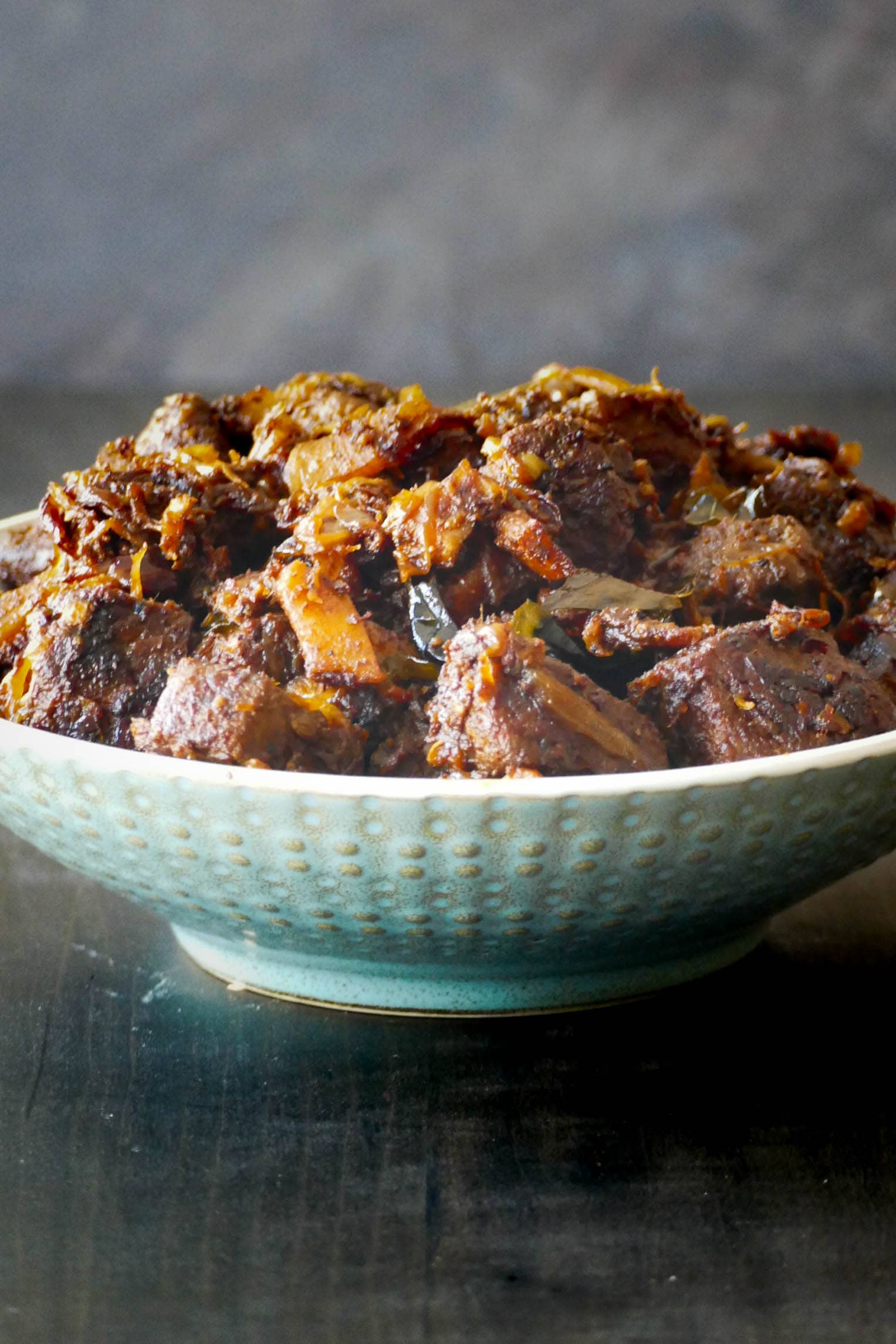 Kerala beef fry ularthiyathu served in traditional bowl