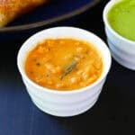 Coconut red chutney in white bowl.