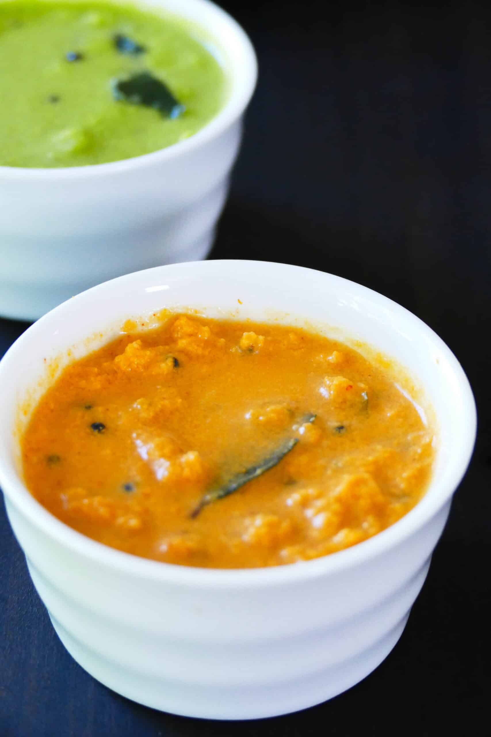 Coconut red chutney in white bowl.