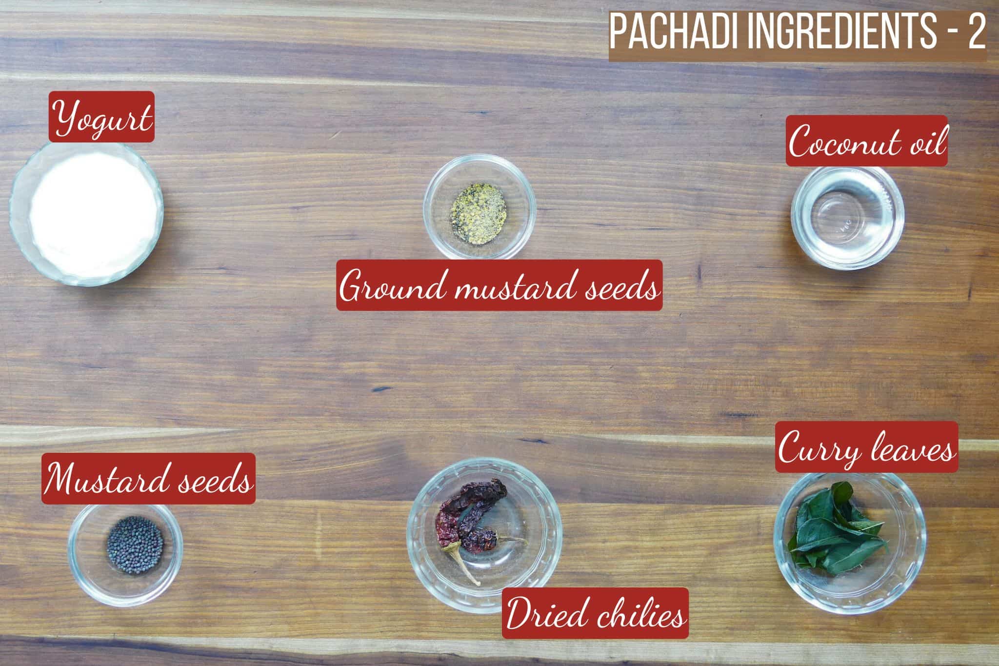Mango pachadi ingredients on wooden counter - part 2.