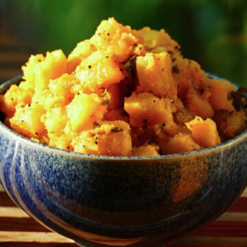 Potato masala in blue bowl.