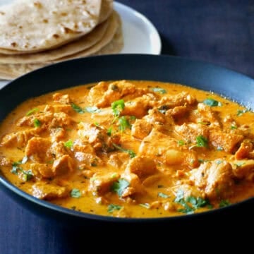 Instant Pot Chicken Tikka Masala in black bowl with rotis.