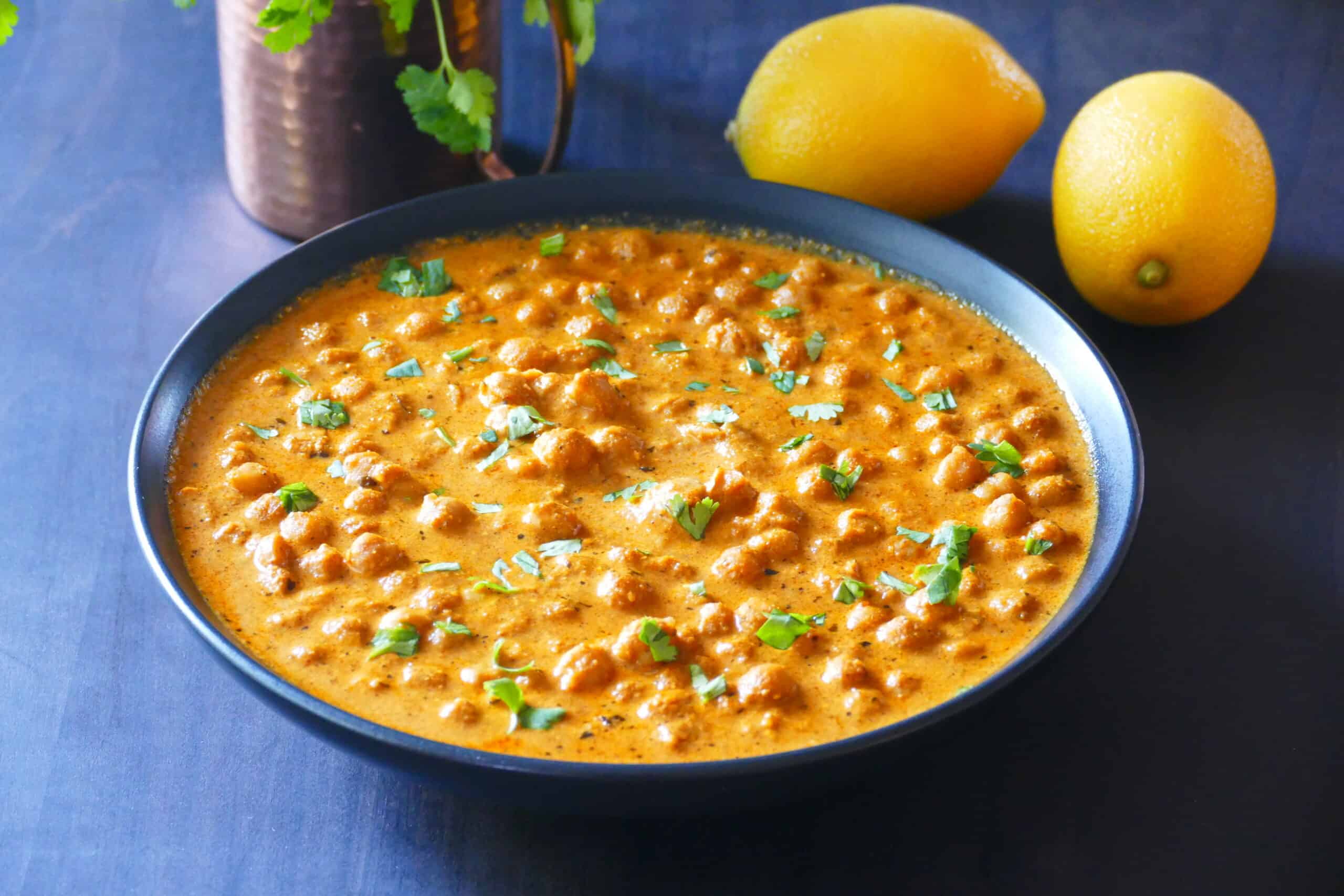 Chickpea Tikka Masala in black bowl.