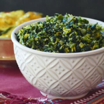 White bowl with spinach thoran.